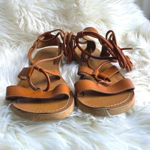 Tan leather wrap around sandals by Kenneth Cole Reaction